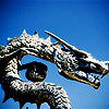 sarcastic_ink: A stone dragon with a bright blue sky background. (dragon: blue sky)