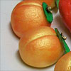 redsixwing: Photo of faux-gilded marzipan peaches. (golden peaches of immortality)