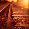 ninamalfoy: close-up of train tracks (lines pointing to the horizon), sepia tint (travelling)