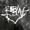 avalanche: Spray painting on the wall, white on grey. Writing says robin above a sign of bat. (Magis ~~ Robin / Bat)