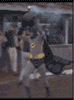 effseedee: Adam West Batman runs zanily through a street, carrying an old-timey smoking bomb above his head. It is hilarious. (Some days you just can't get rid of 'em)