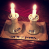 kass: two lit Shabbat candles (candles)