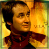ext_990129: Michael Keating as Vila Restal from Blake's 7 looking upwards and to the right with caption: Vila (what?)