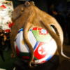 eightlazylegs: A sculpture of a brown octopus on a soccer ball (Soccer)