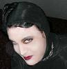 sistawendy: me in a Gorey vamp costume looking up (skeptic coy Gorey tilted down)