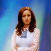 seraphina_snape: Cassandra Cillian from the tv show The Librarians. She is dressed in a white shirt and a light blue vest and has her arms crossed. The background has been replaced by a texture in shades of blue. (Lib_ Cassandra)