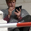 king: Arthur, in chain mail, uses a stylus on a handheld device. (✖ z matt's legacy goes on)