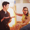 shopfront: Source: Supergirl. Kara presenting Barry to people with ta-da flourish of her arms (Supergirl - best of smiley superfriends)