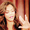 laulan: Zoe Saldana holding her hand up in the Vulcan salute, smirking slightly. ([star trek] high five? hell yes.)