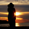 kalmialatifolia: silhouette of a woman in a large hat on a beach at sunset (love you forever if i ever love at all)