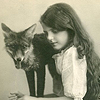 kalmialatifolia: sepia, a girl in a vintage white dress beside a laughing fox (but foxes are foxes)