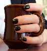 theora: me holding a coffee mug (black coffee)