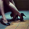 saintbounty: a photo of two pairs of legs, both in heels, suggesting intimate contact (flirt)