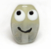 kalorlo: a smileyface glass bead, looking up and left (Default)