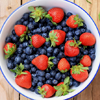 zdenka: A bowl of blueberries and strawberries. (food)