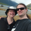 crazyscot: Selfie, with C, in front of an alpine lake (Default)