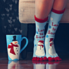 wubomei: feet wearing snowman socks next to a matching cup (christmas socks and cup)