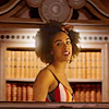 muccamukk: Bill standing in front of the TARDIS bookshelf. (DW: Queen of Books)