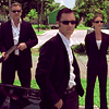 sarcasticsra: A picture of Jeffrey Donovan, Gabrielle Anwar, and Bruce Campbell dressed in black suits and wearing sunglasses. (burn notice: OT3 forever)