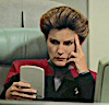 egret: Capt. Janeway reading a paid (janewayreading)