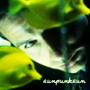 runpunkrun: fox mulder looking through a fishtank, text: runpunkrun (they say goldfish have no memory)