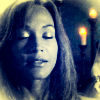 mlravenwrites: Close-up of Teyla Emmagen with her eyes closed, several lit candles floating behind her. The image has a vintage-y navy/sepia tone to it. (teyla candles eyes closed)