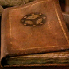 juniperphoenix: An old book with the Watcher seal stamped on the cover (HL: Chronicle)