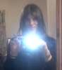 ext_166666: "Photo of me in the mirror, holding up blue orb of death" (Default)