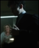 iamnotgod: A man, hands up at chest level, staring left and down (In The Dark)