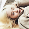 venusundae: krystal lying in a sweater with her blond hair splayed around her (２６３ (you pulled it off well))