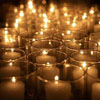 grundyscribbling: large group of tealights in glass holders (lighting candles)