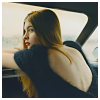 fullupwithfire: a young woman in the passenger seat of a car, leaning forward over the dashboard and looking to the left (pic | only two people in the world)