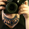 dragonlady7: self-portrait but it's mostly the DSLR in my hands in the mirror (Default)