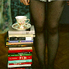 elucidate_this: stack of books with a teacup sitting on top (books and tea)