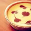 vicky_carter: Edible cream decorated with hearts and contained inside a small round pot (Cream with hearts)