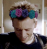 writedragon: Ray Kowalski from due South wearing a blue, purple and pink flower crown (bi pride crown RK)
