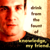 dorinda: Bobby Hobbes from The Invisible Man, wearing a black T-shirt, with the text "drink from the fount of knowledge, my friend". (iman_bobby_knowledge)