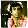 grayswandir: Klinger in a frilly pink dress, with the text "soldier." (MASH: Max Klinger)