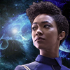 esteefee: Michael Burnham in heroic stance with multicolored planets and swirling nebula behind her (michael)