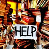 wendelah1: hands holding a sign that says help amidst piles of books (Books we're drowning in them)