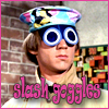 amedia: Peter Tork wearing a goofy hat with connected goggles that hang down over his eyes. Captaion: slash goggles (Monkees slash goggles)