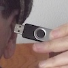 jesse_the_k: USB jump drive pointing into my left ear (JK data in ear)
