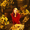 auroracloud: Amy Pond (red-haired young woman) surrounded by lots of sunflowers, from Doctor Who (Amy sunflowers)