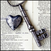 ext_7816: Metal heart and key on an open book. (Heart/Key OTP)