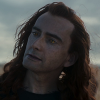 jadislefeu: David Tennant in a long curley red wig with yellow slitted eyes (crowley)
