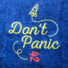 hitchhiker: image of "don't panic" towel with a rocketship and a 42 (Default)
