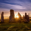 dunmurderin: a stone circle in the foreground; the sunrise in the background (oldtoadwoman)