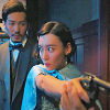 mekare: Xiao Man pointing a gun, Luo Fei behind her (Detective L)