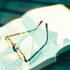 thoughtfulromantics: An open book with a pair of glasses resting on top (Read clearly)