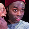 kore: (Paapa Essiedu as Hamlet holding a skull)